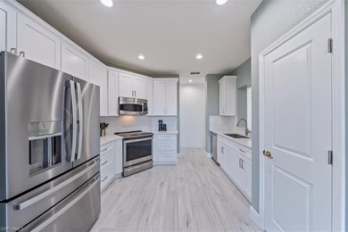 Completely renovated and reimagined, this stunning Sotheby floor on West Bay Beach and Golf Club in Florida - for sale on GolfHomes.com, golf home, golf lot