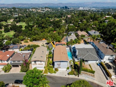 This exceptionally rare two-story view home is on the market for on Woodland Hills Country Club in California - for sale on GolfHomes.com, golf home, golf lot