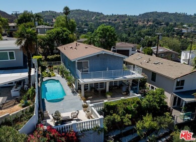 This exceptionally rare two-story view home is on the market for on Woodland Hills Country Club in California - for sale on GolfHomes.com, golf home, golf lot