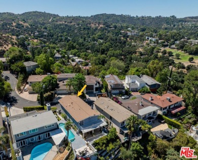 This exceptionally rare two-story view home is on the market for on Woodland Hills Country Club in California - for sale on GolfHomes.com, golf home, golf lot