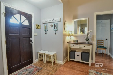This charming single-story cottage features 3 bedrooms and 2 on Lake Forest Yacht and Country Club in Alabama - for sale on GolfHomes.com, golf home, golf lot