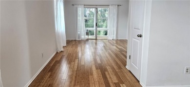 Come see this light, bright & airy renovated 2 bedroom-2 bath on The American Golf Club in Florida - for sale on GolfHomes.com, golf home, golf lot