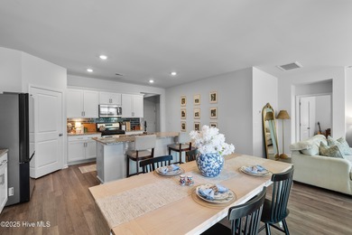 Nestled in the highly sought-after Brunswick Forest community on Cape Fear National At Brunswick Forest in North Carolina - for sale on GolfHomes.com, golf home, golf lot