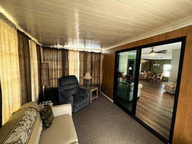 Experience comfortable living in this beautifully updated on Lake Henry Golf Club in Florida - for sale on GolfHomes.com, golf home, golf lot