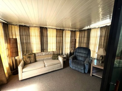 Experience comfortable living in this beautifully updated on Lake Henry Golf Club in Florida - for sale on GolfHomes.com, golf home, golf lot