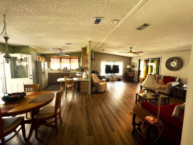 Experience comfortable living in this beautifully updated on Lake Henry Golf Club in Florida - for sale on GolfHomes.com, golf home, golf lot