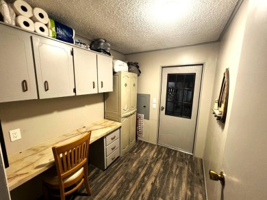 Experience comfortable living in this beautifully updated on Lake Henry Golf Club in Florida - for sale on GolfHomes.com, golf home, golf lot