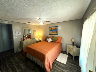 Experience comfortable living in this beautifully updated on Lake Henry Golf Club in Florida - for sale on GolfHomes.com, golf home, golf lot