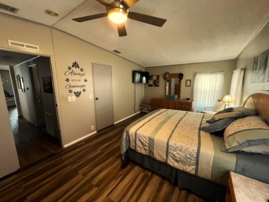 Experience comfortable living in this beautifully updated on Lake Henry Golf Club in Florida - for sale on GolfHomes.com, golf home, golf lot