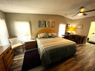 Experience comfortable living in this beautifully updated on Lake Henry Golf Club in Florida - for sale on GolfHomes.com, golf home, golf lot
