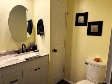 Experience comfortable living in this beautifully updated on Lake Henry Golf Club in Florida - for sale on GolfHomes.com, golf home, golf lot