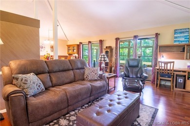 Welcome to your perfect retreat in the iconic Tan Tar A on The Oaks Golf Course in Missouri - for sale on GolfHomes.com, golf home, golf lot