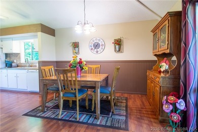 Welcome to your perfect retreat in the iconic Tan Tar A on The Oaks Golf Course in Missouri - for sale on GolfHomes.com, golf home, golf lot