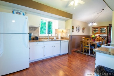 Welcome to your perfect retreat in the iconic Tan Tar A on The Oaks Golf Course in Missouri - for sale on GolfHomes.com, golf home, golf lot