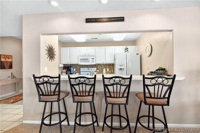 Not 1 but 2 BOAT SLIPS INCLUDED. Top-floor, end-unit lakefront on Seasons Ridge At Four Seasons in Missouri - for sale on GolfHomes.com, golf home, golf lot