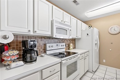 Not 1 but 2 BOAT SLIPS INCLUDED. Top-floor, end-unit lakefront on Seasons Ridge At Four Seasons in Missouri - for sale on GolfHomes.com, golf home, golf lot