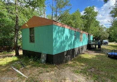 Excellent opportunity to acquire a fully rented four-property on The Lakes Country Club in North Carolina - for sale on GolfHomes.com, golf home, golf lot