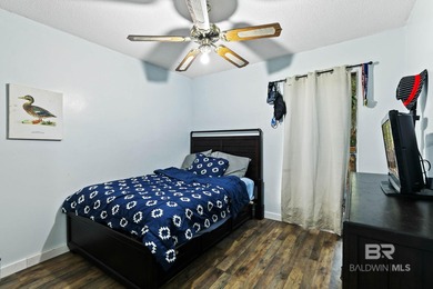 Looking for a home that feels like a cozy retreat tucked away in on Lake Forest Yacht and Country Club in Alabama - for sale on GolfHomes.com, golf home, golf lot