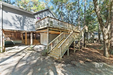 Looking for a home that feels like a cozy retreat tucked away in on Lake Forest Yacht and Country Club in Alabama - for sale on GolfHomes.com, golf home, golf lot