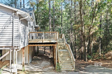 Looking for a home that feels like a cozy retreat tucked away in on Lake Forest Yacht and Country Club in Alabama - for sale on GolfHomes.com, golf home, golf lot