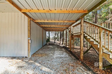 Looking for a home that feels like a cozy retreat tucked away in on Lake Forest Yacht and Country Club in Alabama - for sale on GolfHomes.com, golf home, golf lot