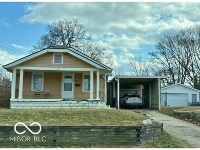 This cute bungalow sits on a large lot with an attached garage on Meadowbrook Golf Course in Indiana - for sale on GolfHomes.com, golf home, golf lot