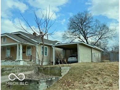 This cute bungalow sits on a large lot with an attached garage on Meadowbrook Golf Course in Indiana - for sale on GolfHomes.com, golf home, golf lot
