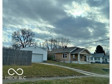 This cute bungalow sits on a large lot with an attached garage on Meadowbrook Golf Course in Indiana - for sale on GolfHomes.com, golf home, golf lot