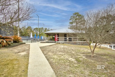 Looking for a home that feels like a cozy retreat tucked away in on Lake Forest Yacht and Country Club in Alabama - for sale on GolfHomes.com, golf home, golf lot