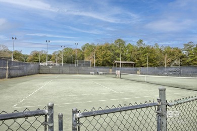 Looking for a home that feels like a cozy retreat tucked away in on Lake Forest Yacht and Country Club in Alabama - for sale on GolfHomes.com, golf home, golf lot