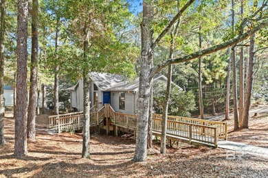Looking for a home that feels like a cozy retreat tucked away in on Lake Forest Yacht and Country Club in Alabama - for sale on GolfHomes.com, golf home, golf lot