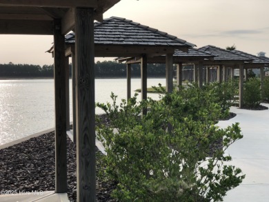 Welcome to this stunning home in the resort-style, gated golf on Compass Pointe Golf Course in North Carolina - for sale on GolfHomes.com, golf home, golf lot