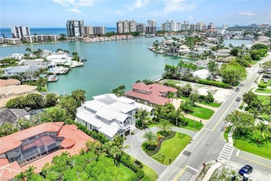 Experience unparalleled luxury in this exceptional bay front on The Moorings Country Club in Florida - for sale on GolfHomes.com, golf home, golf lot