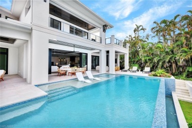 Experience unparalleled luxury in this exceptional bay front on The Moorings Country Club in Florida - for sale on GolfHomes.com, golf home, golf lot