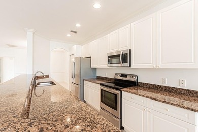 Beautiful villa with a pool and spa, ideally situated on the on Arrowhead Golf Club At Heritage Greens in Florida - for sale on GolfHomes.com, golf home, golf lot