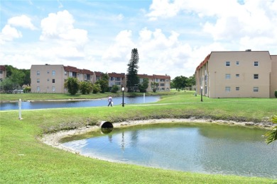 This is a well located ground floor unit with all tile floors, a on Sunrise Lakes Phase III in Florida - for sale on GolfHomes.com, golf home, golf lot