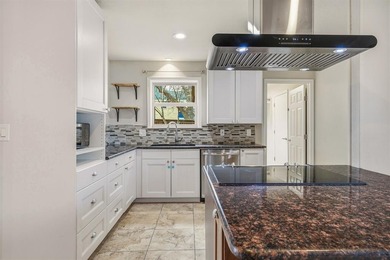 Step into this beautifully updated 3-bedroom, 2-bath home, where on Pecan Plantation Country Club in Texas - for sale on GolfHomes.com, golf home, golf lot