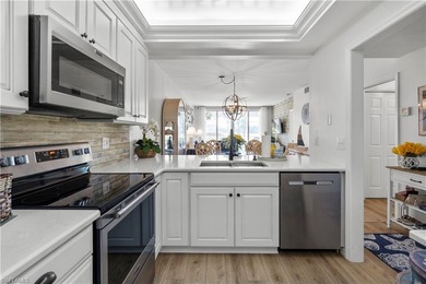 Step into refined living in this beautifully updated first-floor on Golfview Golf and Racquet Club in Florida - for sale on GolfHomes.com, golf home, golf lot