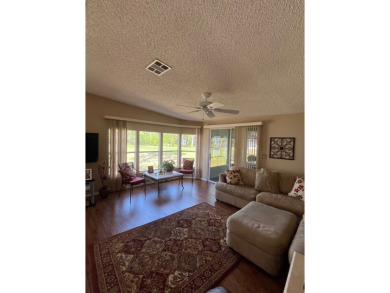 Welcome to this beautifully maintained two-bedroom, two-bath on Pine Lakes Country Club in Florida - for sale on GolfHomes.com, golf home, golf lot