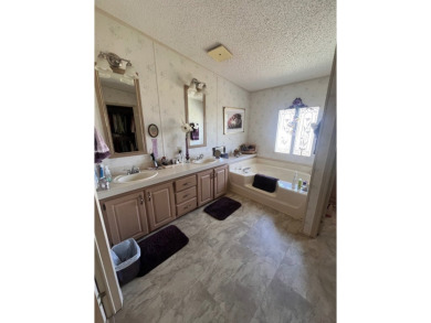 Welcome to this beautifully maintained two-bedroom, two-bath on Pine Lakes Country Club in Florida - for sale on GolfHomes.com, golf home, golf lot