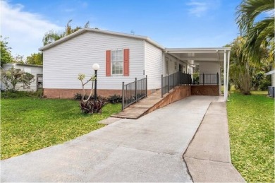 This charming home has been meticulously maintained, showcasing on Barefoot Bay Golf Course in Florida - for sale on GolfHomes.com, golf home, golf lot