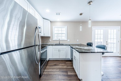 CHARMING UPGRADED BRIARCLIFF TERRACE POCONOS LAKE BI-LEVEL HOME on Pocono Farms Country Club in Pennsylvania - for sale on GolfHomes.com, golf home, golf lot