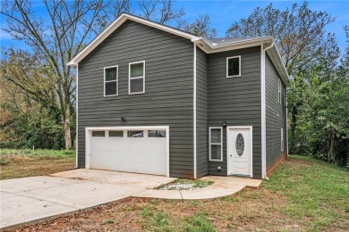 Welcome this sparkling new build literally a stone's throw from on Griffin Country Club in Georgia - for sale on GolfHomes.com, golf home, golf lot