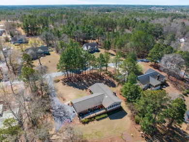 This charming 3-bedroom, 2-bathroom home is situated on a on Quail Ridge Golf Course in North Carolina - for sale on GolfHomes.com, golf home, golf lot