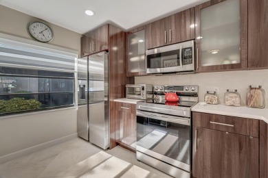 ABSOLUTELY STUNNING GROUND FLOOR CORNER UNIT! GORGEOUS BOTH on Boca Lago Golf and Country Club in Florida - for sale on GolfHomes.com, golf home, golf lot