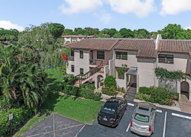 ABSOLUTELY STUNNING GROUND FLOOR CORNER UNIT! GORGEOUS BOTH on Boca Lago Golf and Country Club in Florida - for sale on GolfHomes.com, golf home, golf lot