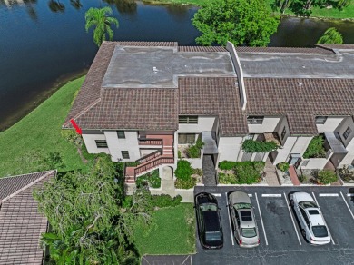 ABSOLUTELY STUNNING GROUND FLOOR CORNER UNIT! GORGEOUS BOTH on Boca Lago Golf and Country Club in Florida - for sale on GolfHomes.com, golf home, golf lot