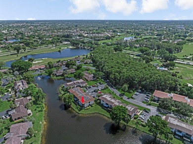 ABSOLUTELY STUNNING GROUND FLOOR CORNER UNIT! GORGEOUS BOTH on Boca Lago Golf and Country Club in Florida - for sale on GolfHomes.com, golf home, golf lot