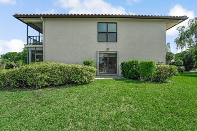 ABSOLUTELY STUNNING GROUND FLOOR CORNER UNIT! GORGEOUS BOTH on Boca Lago Golf and Country Club in Florida - for sale on GolfHomes.com, golf home, golf lot
