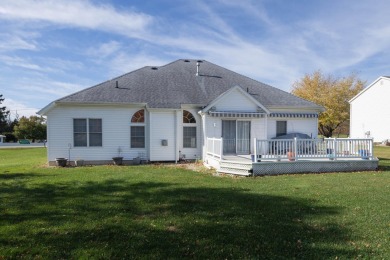 This stunning home situated on a well-manicured 1 acre lot is on Paw Paw Lake Golf Course in Michigan - for sale on GolfHomes.com, golf home, golf lot